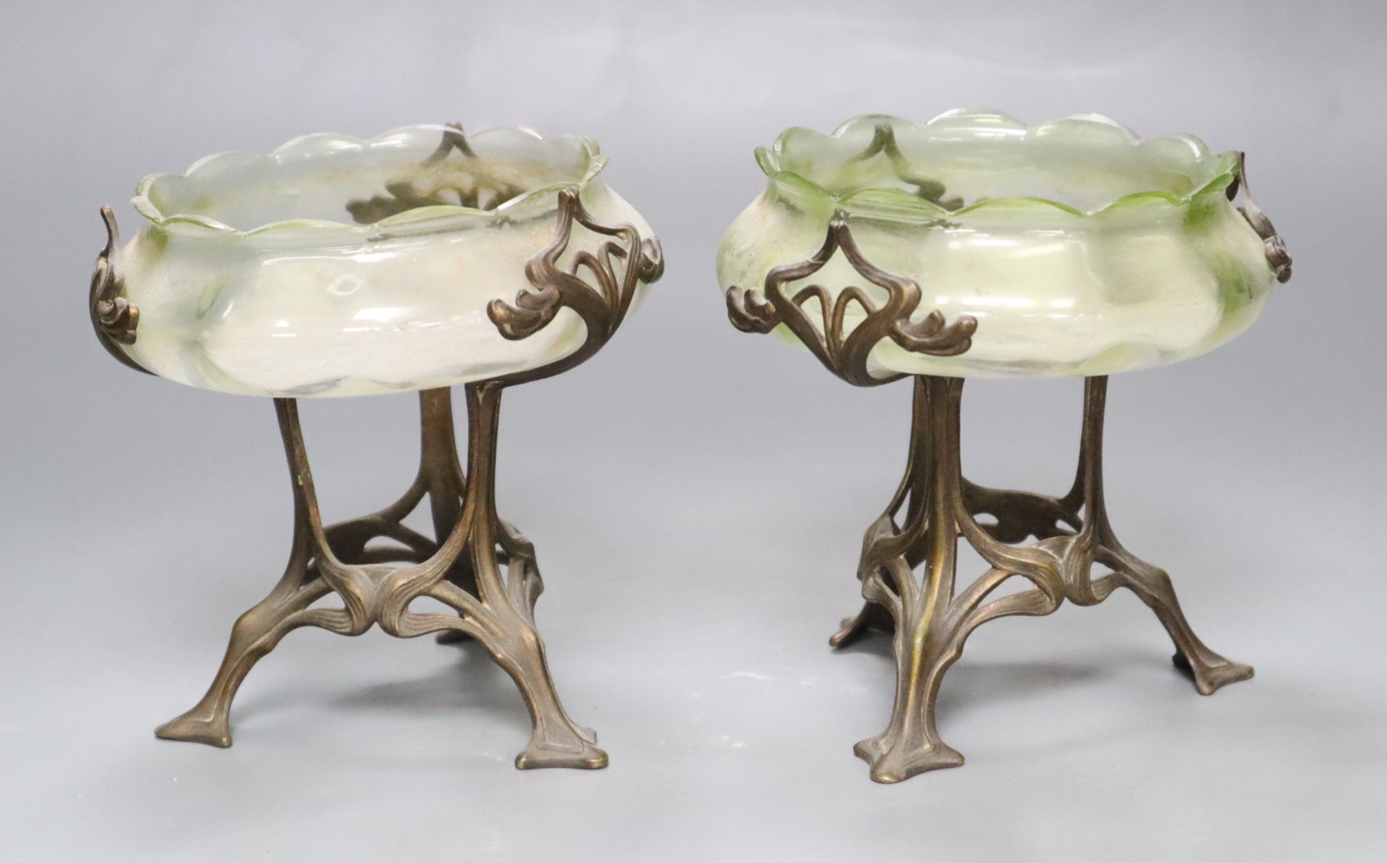 A pair of Art Nouveau vaseline glass dishes, on bronze stands, height 12cm